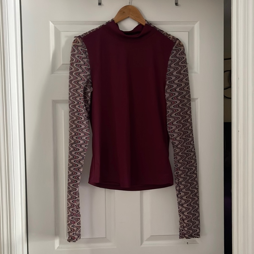 Arms are sheer / fitted